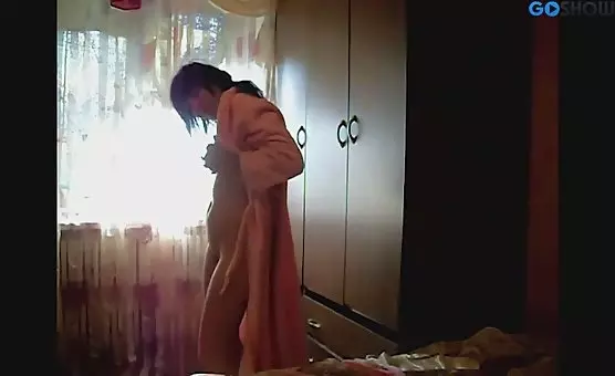 Brunette Entices in Bathrobe